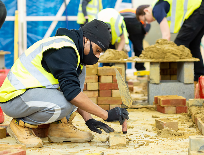 Students bricklaying in workshop